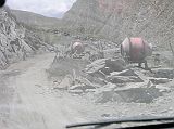 Tibet 08 01 Friendship Highway Construction From Shigatse, it took five hours to drive the 157km to Lhatse, at first paved and then on a good dirt road. After leaving Lhatse, the Friendship Highway became the Friendshit highway, as we climbed 31km in 75 minutes to the highest pass on the Friendship Highway, the Gyatso La (5220m). They are trying to pave the highway all the way to the Nepalese border, so the road was worse than usual.